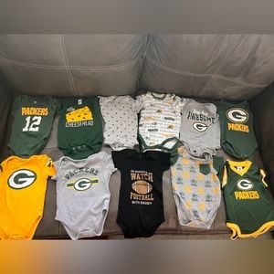 (11) Green Bay Packers onsies sized 3-6m.